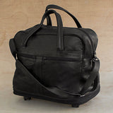 Style Traveler in Black - an Expandable Leather Wheeled Travel Bag in Black from Brazil