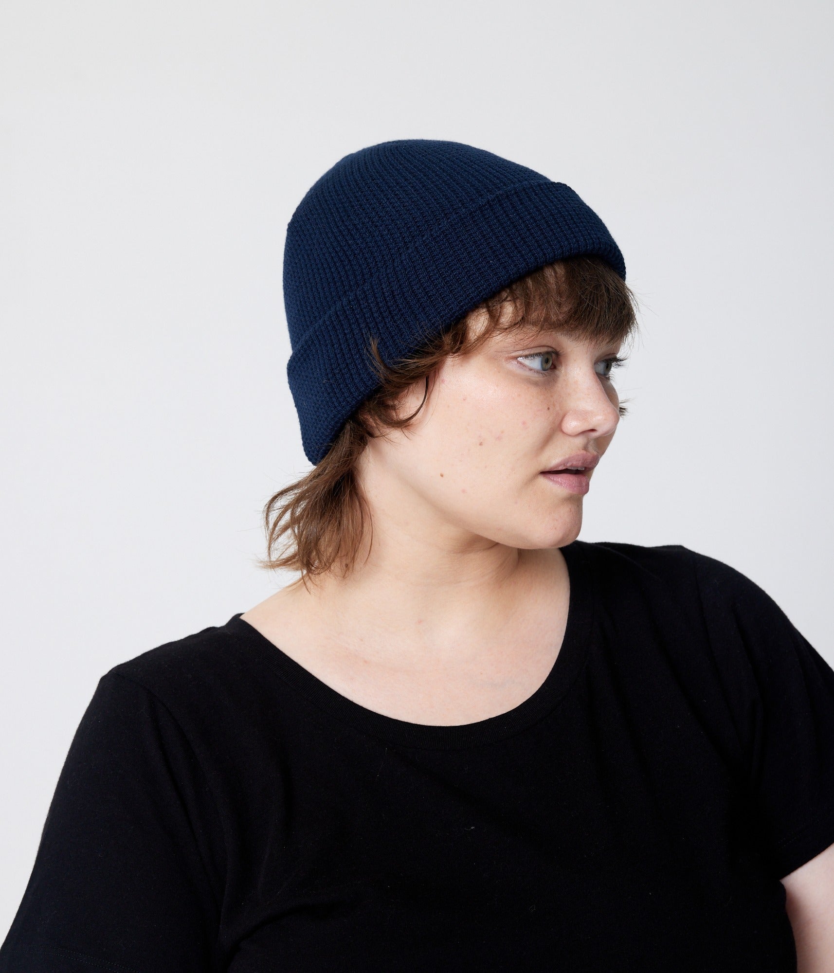 Navy beanie on model (side)