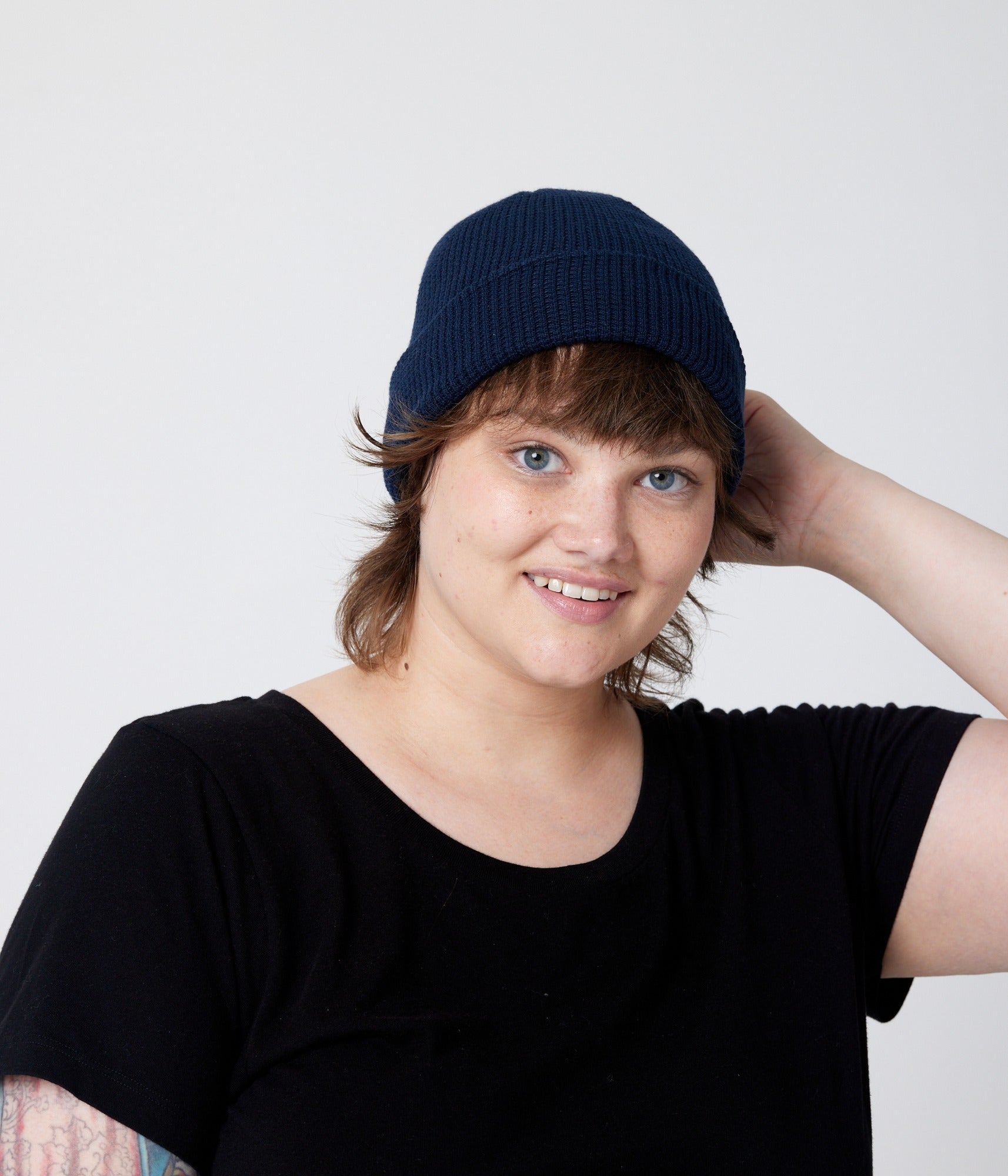 Navy beanie on model