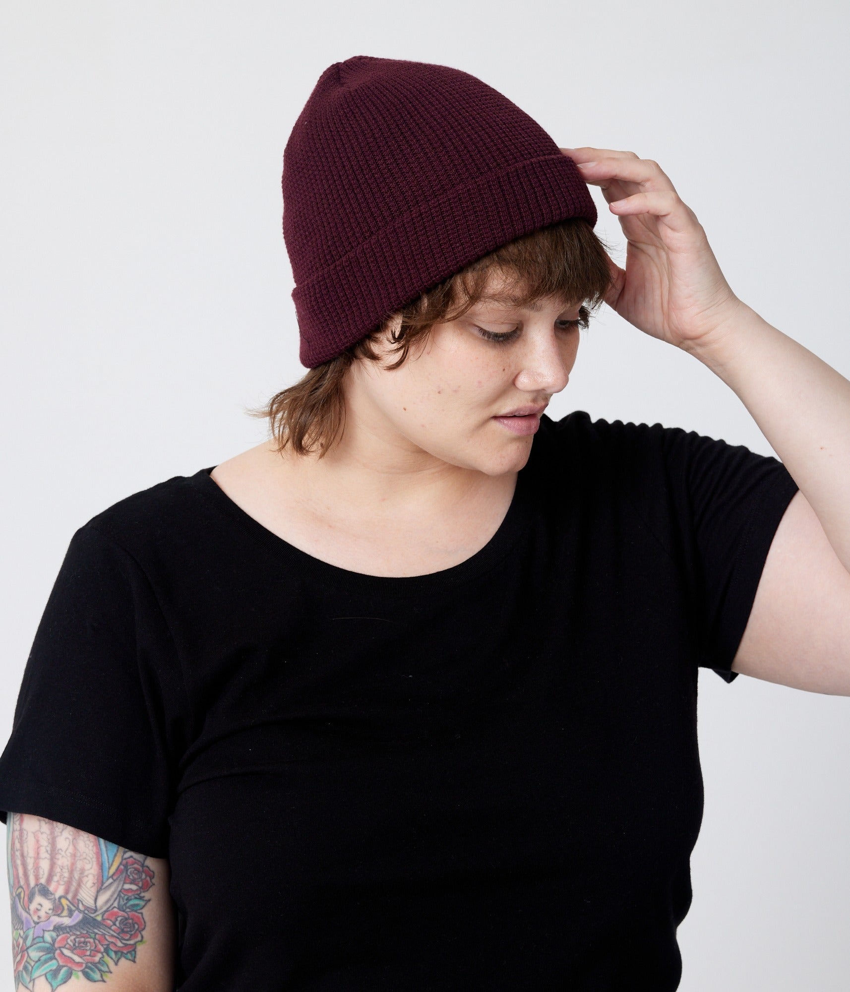 Burgundy beanie on model (side)