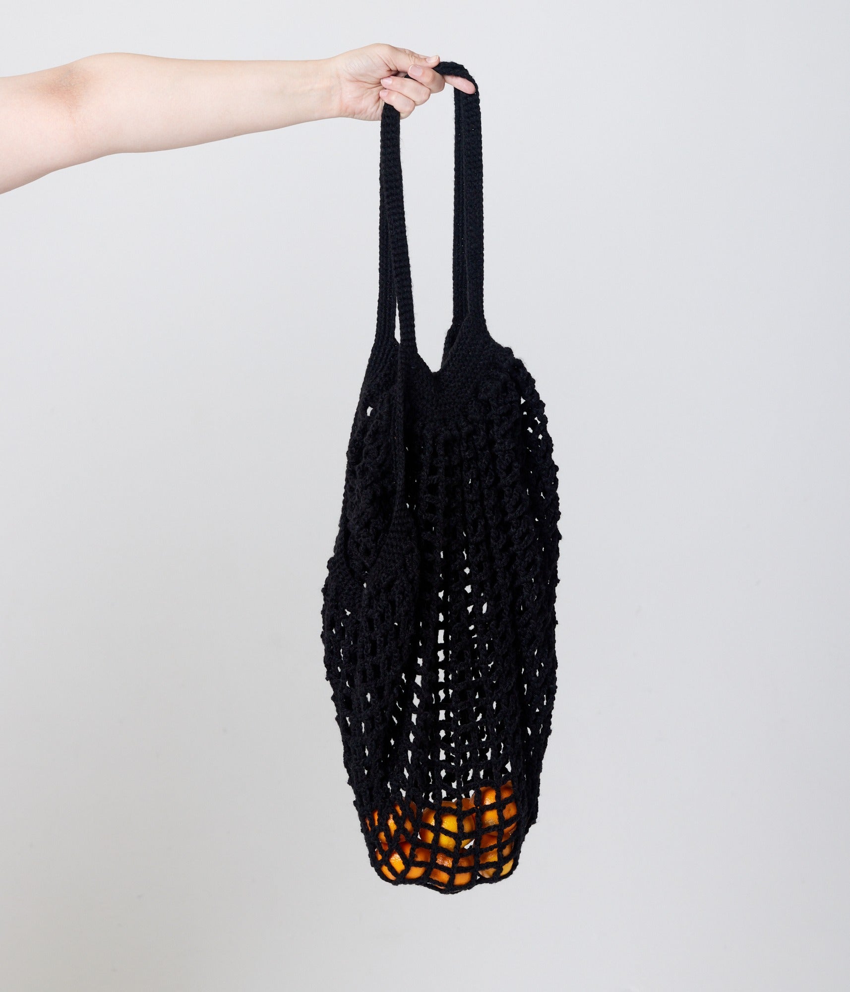 Black bag with fruit inside