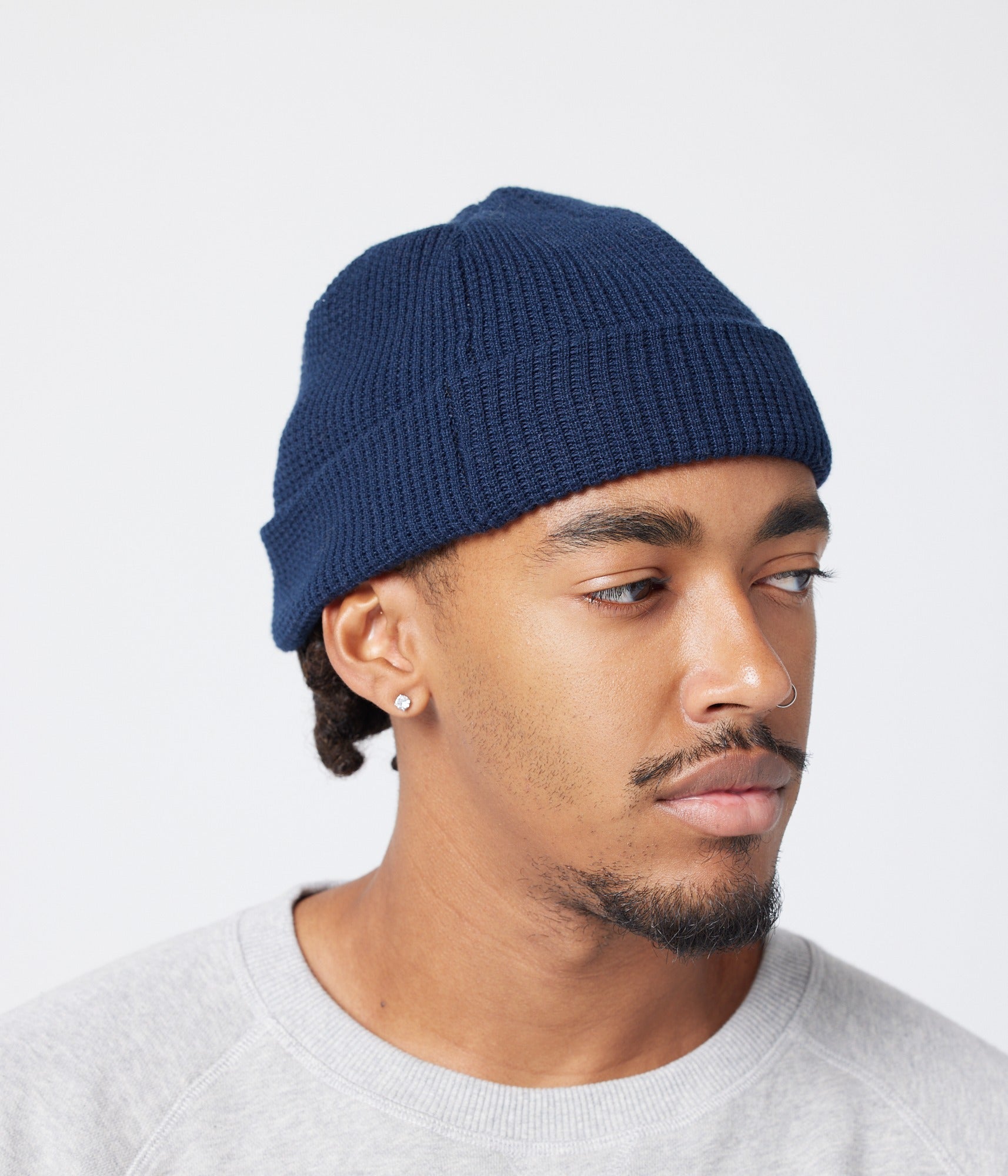 Navy beanie on model (side)