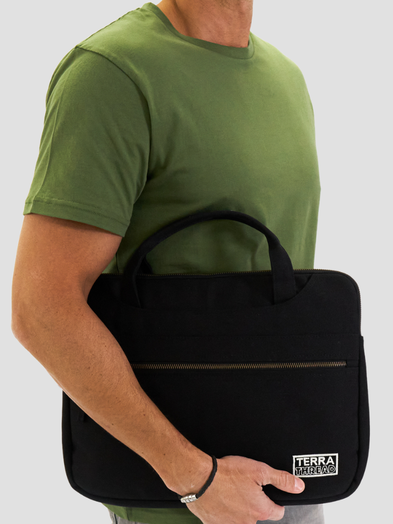 Male model carrying sustainable organic cotton laptop case